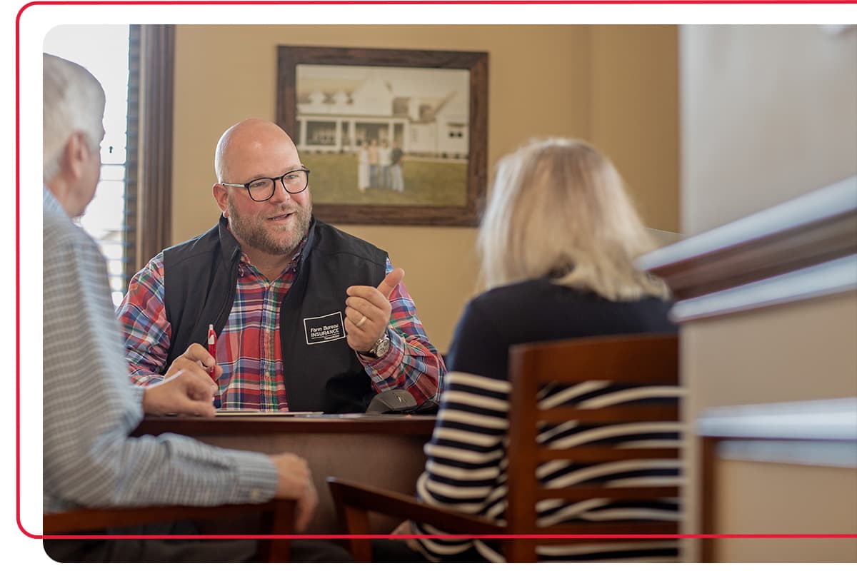 Farm Bureau Insurance of Tennessee agent meeting with an older couple to discuss life insurance policies