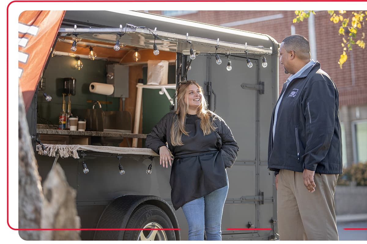 Farm Bureau Insurance of Tennessee agent talking to woman who owns a food truck business