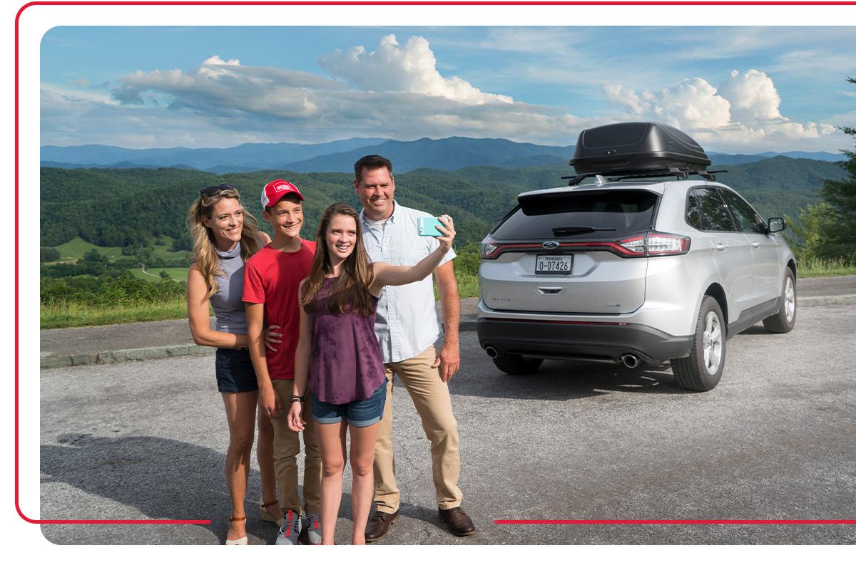 Tennessee family standing next to car
