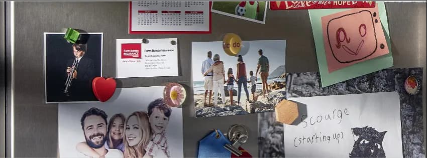 Refrigerator covered with pictures and magnets in a family home kitchen